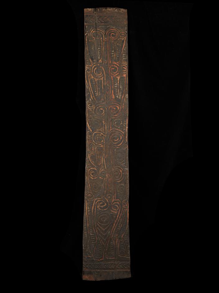 A finely carved, black Iwam war shield from the lower May River area, East Sepik
